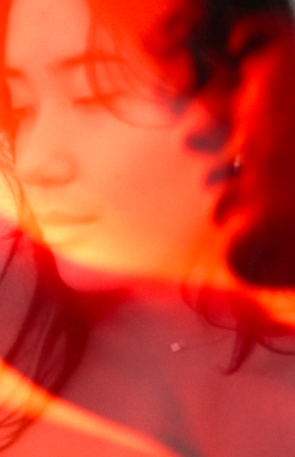 picture of two faces, orange, red, blurred